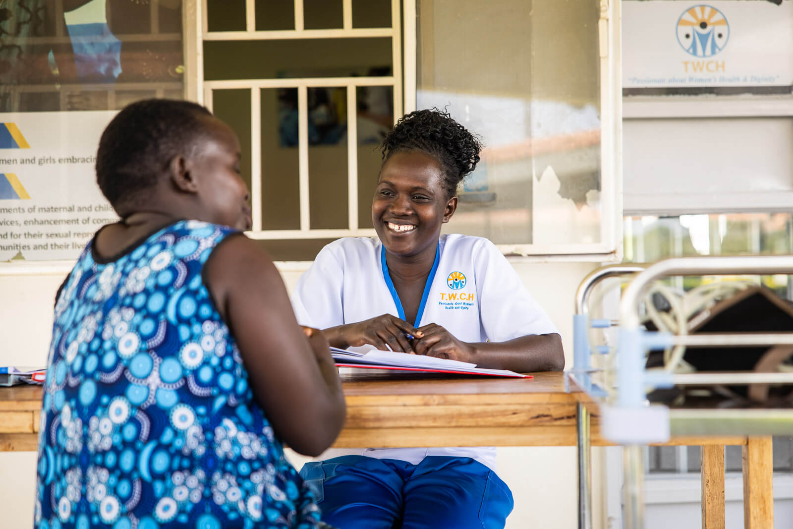 Woman speaking with a health care provider at TERREWODE Women's Community Hospital