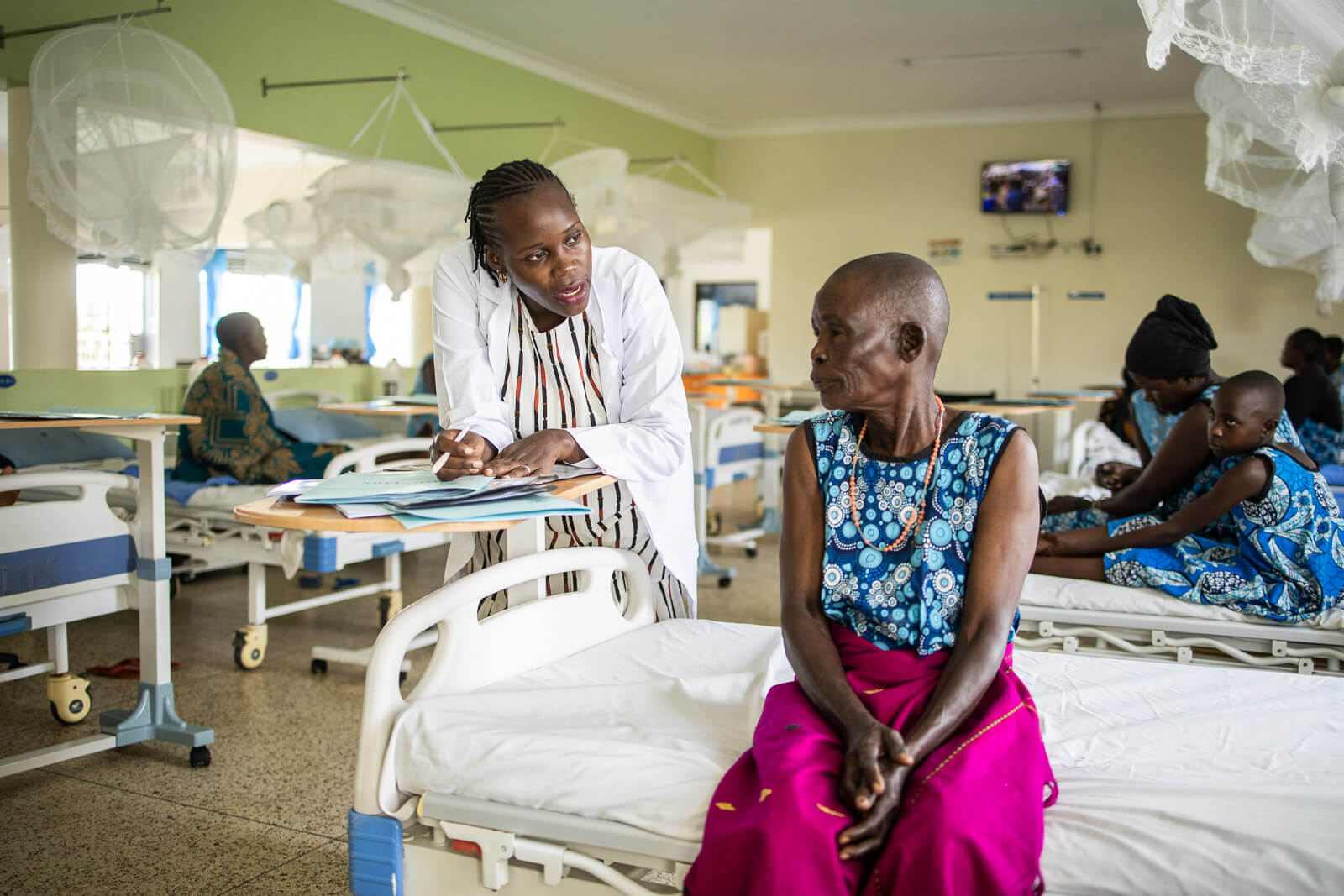 Medical team providing surgical care to a patient in Uganda