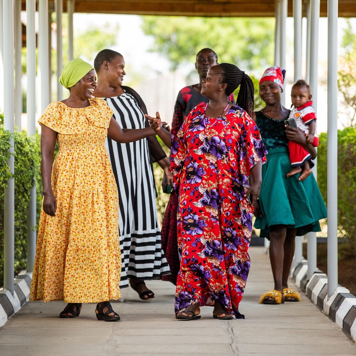 Women at TWCH Women walking together outside fistula treatment and maternal health facility