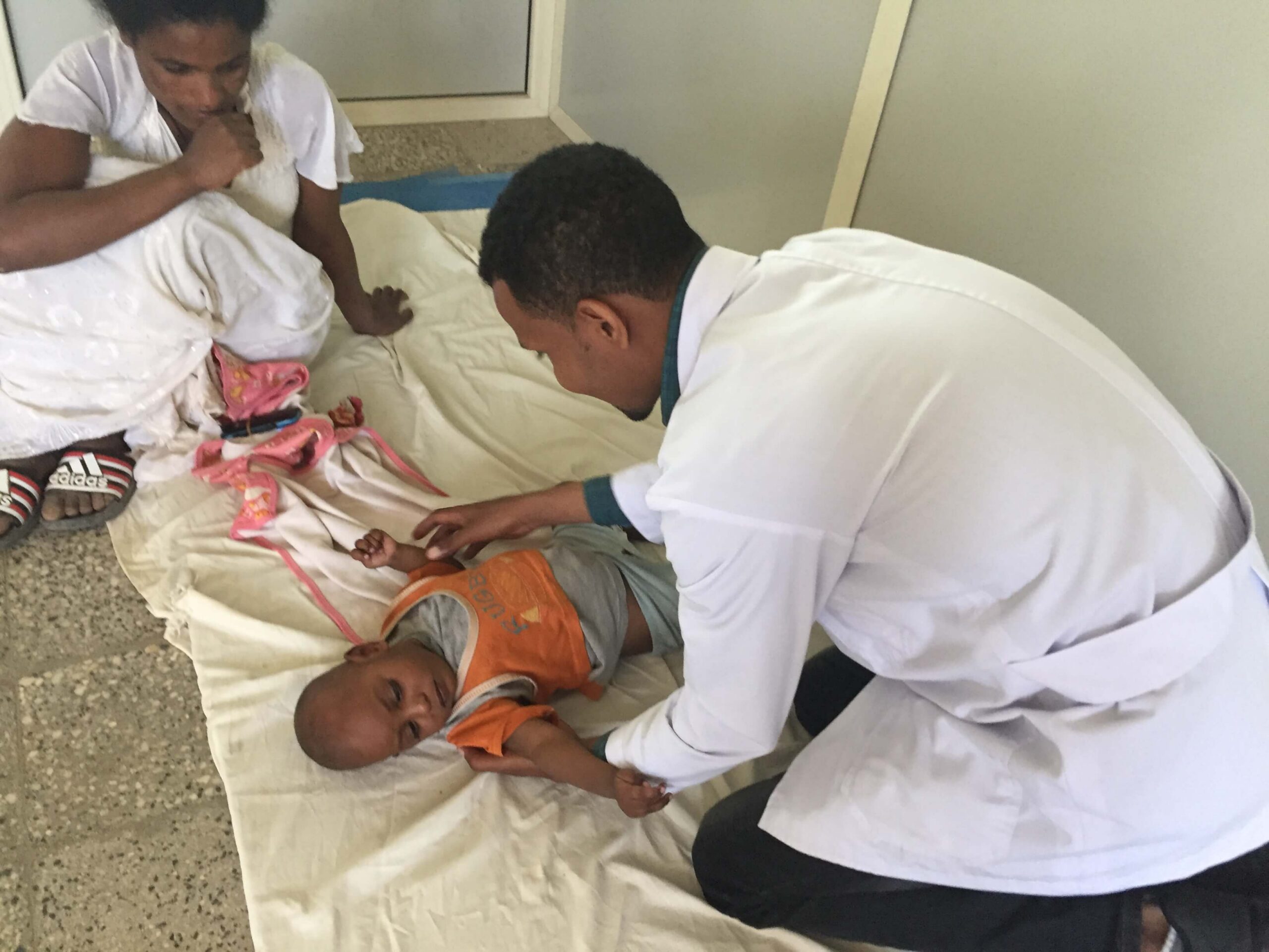 A health worker caring for a mother and baby in Ethiopia