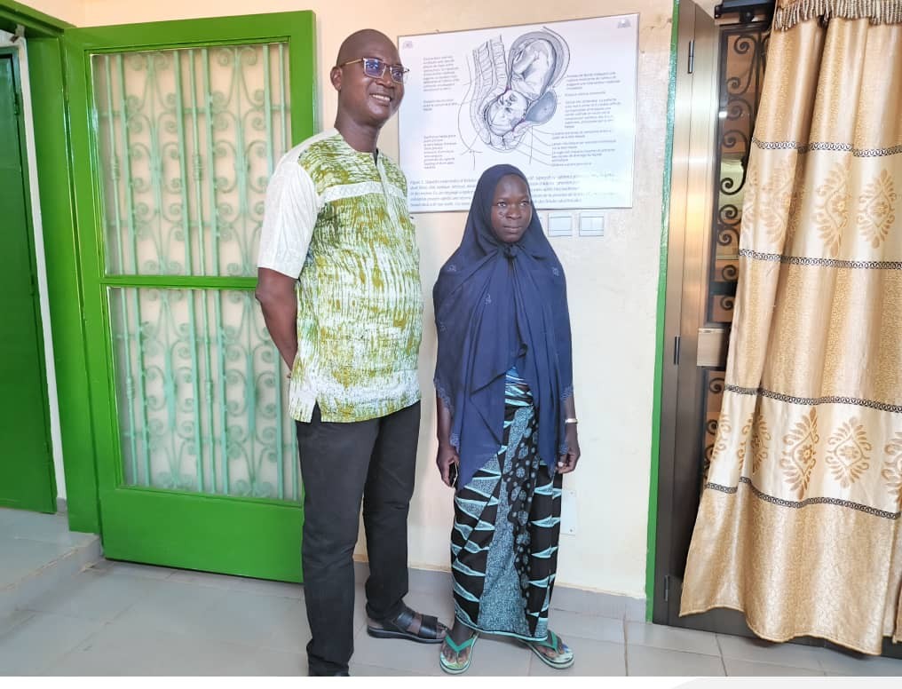 Dr. Itengre Ouedraogo meeting with a survivor during a follow-up visit