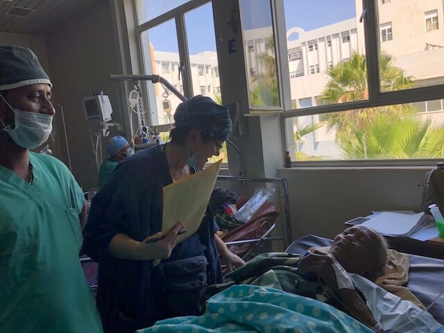 Medical staff caring for a fistula patient in a hospital