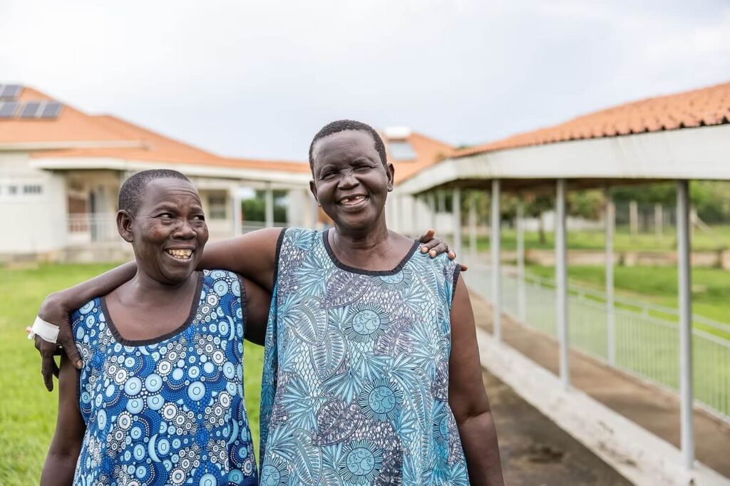 Two Terrewode women fistula patients hugging outside
