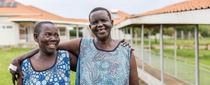Two Terrewode women fistula patients hugging outside