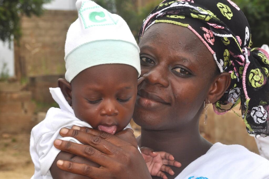 Nigerian woman holding baby